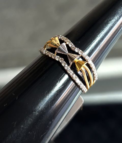 Wide diamond ring with a crossover design